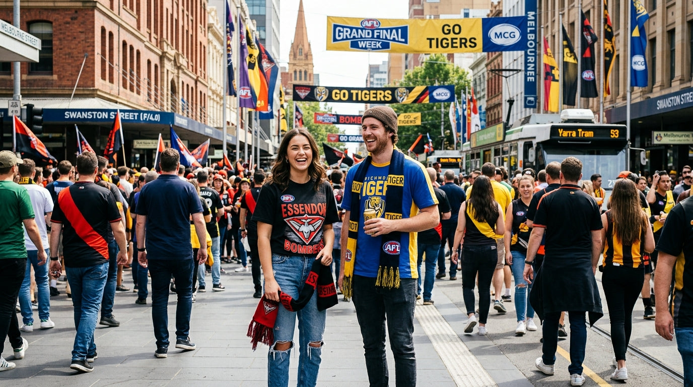 Two Australians in AFL graphic tees in Melbourne CBD during Grand Final week